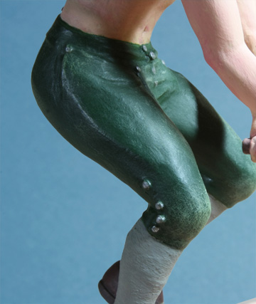 Close-up of 18th-century wheelwright's arms and knees, 1/20th scale